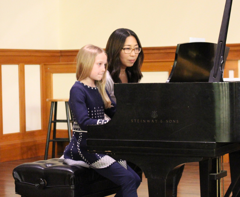 CCM instructor Masako Yotsugi with her student at a recital.